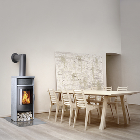 Wood stove BANDO with soapstone cladding in a minimalist living area