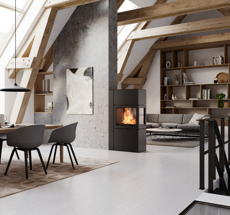 600 RD als Raumteiler zwischen Esszimmer und Wohnzimmer Kaminofen 600 RD in der Farbe Schwarz fungiert als Raumteiler zwischen Esszimmer und modernem Wohnzimmer